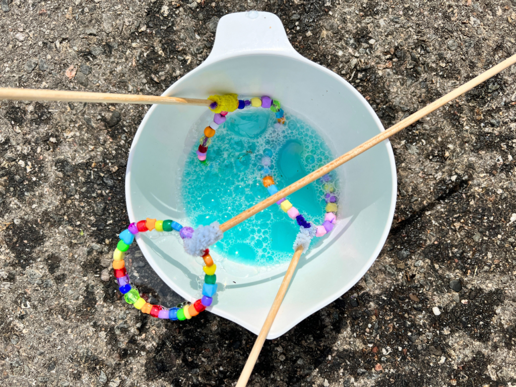 bubble wands in bowl of solution