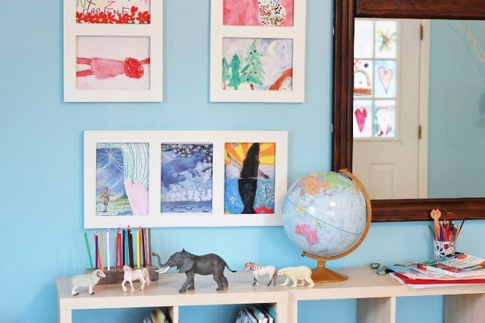 framed artwork above shelf