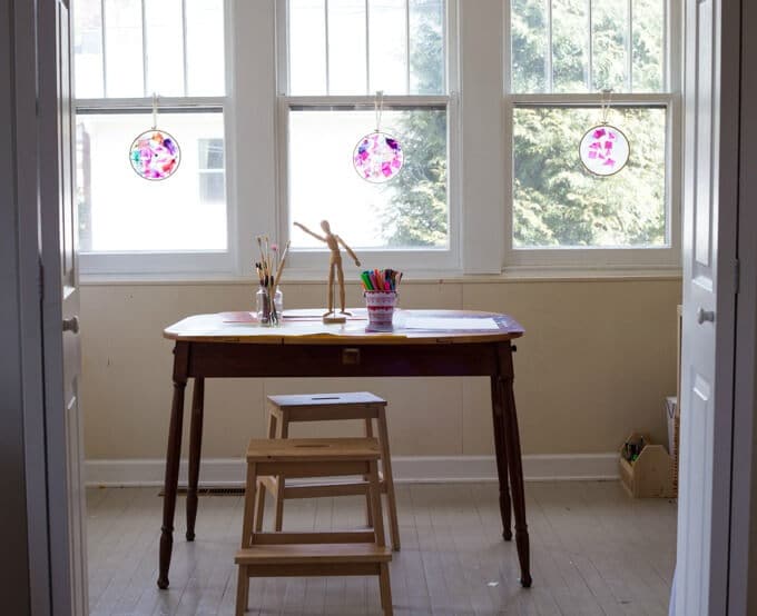 Tissue paper suncatchers hanging in the windows