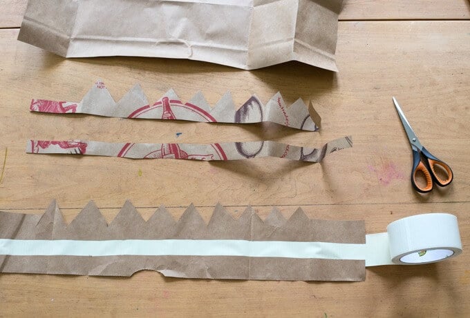 How to add duct tape to make paper grocery bag crowns.