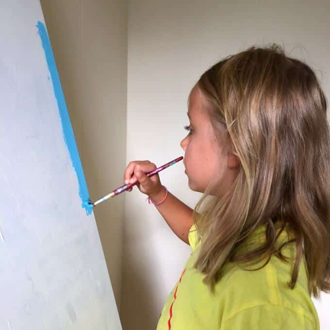 painting blue over white