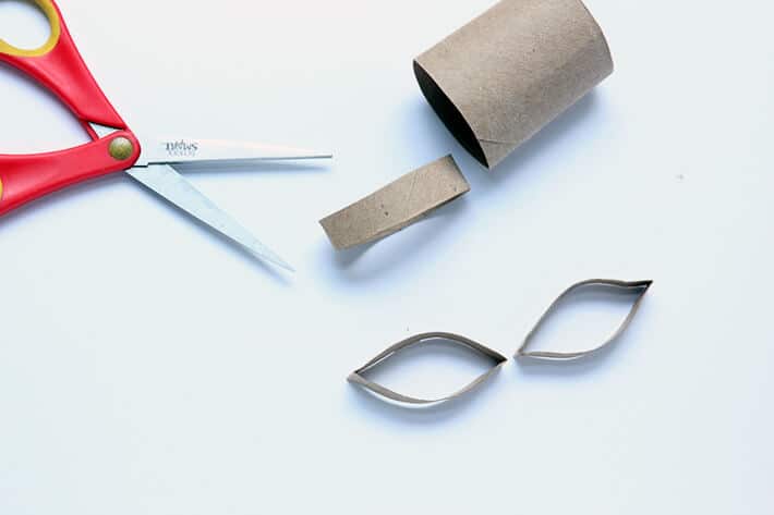 Cutting eye shapes from cardboard tube