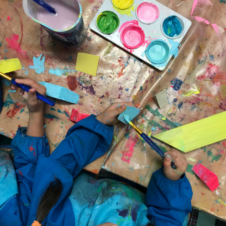 children painting blocks