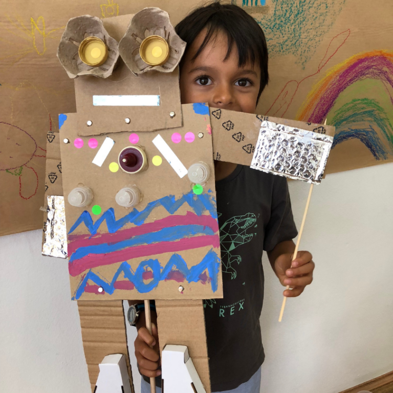 child with robot puppet