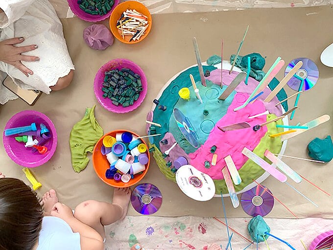 Playdough play with toddlers including craft sticks, cds, and recycled lids
