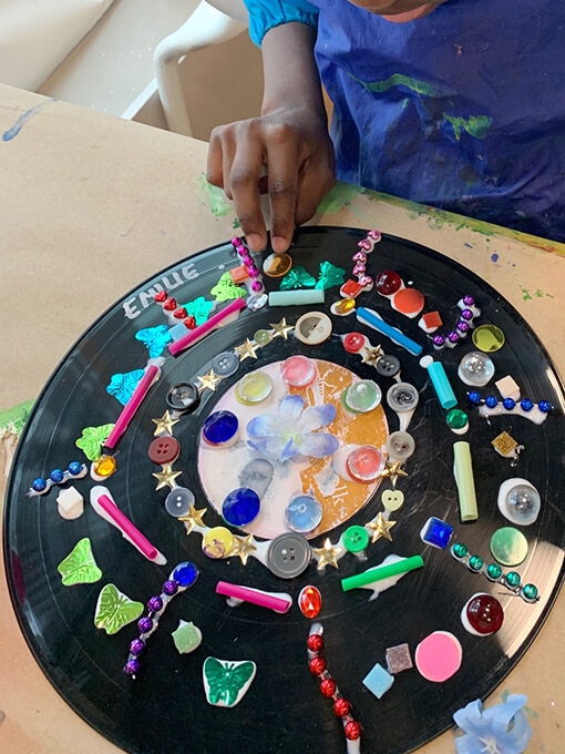 Adding-loose-parts-to-a-record-mandala-art-project