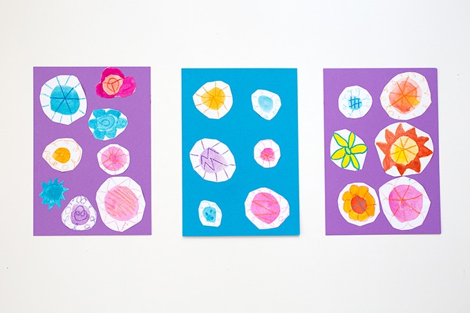 Watercolor doodle flowers on colored paper