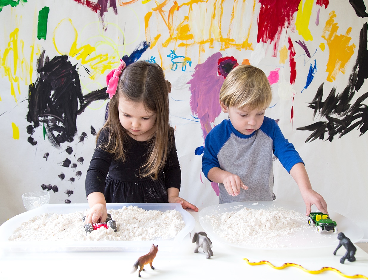 Toddler-with-cloud-dough-and-toys