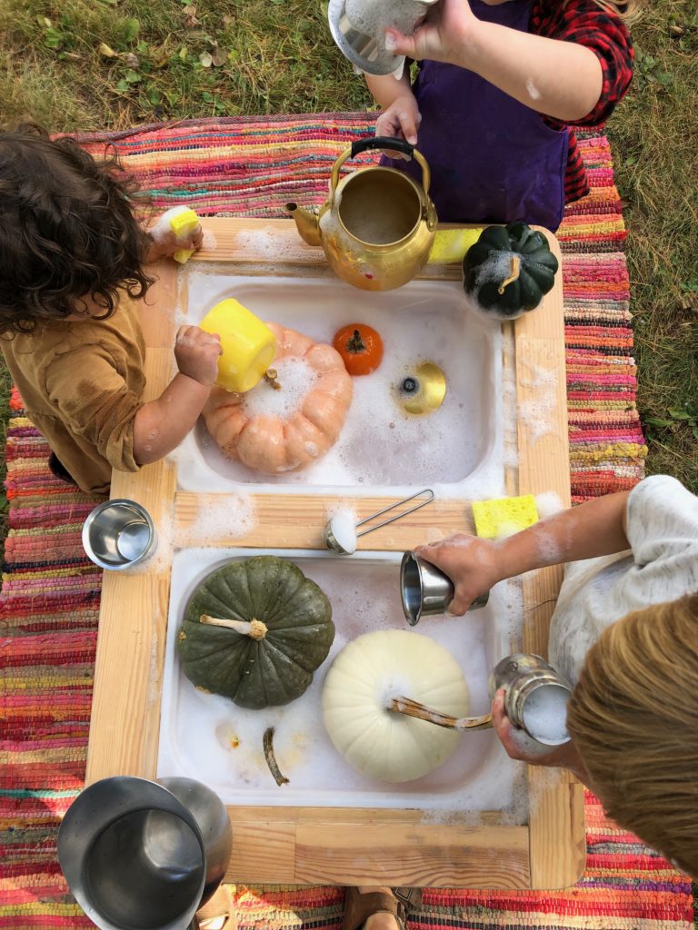 fall sensory bins for kids-washing guords