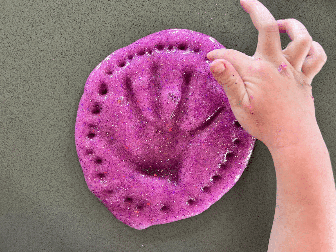 playing with glitter slime