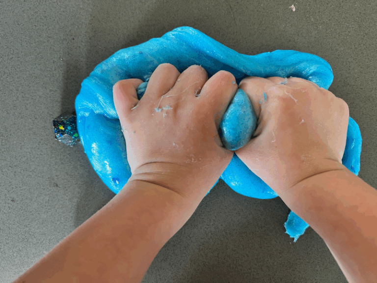 kneading glitter slime