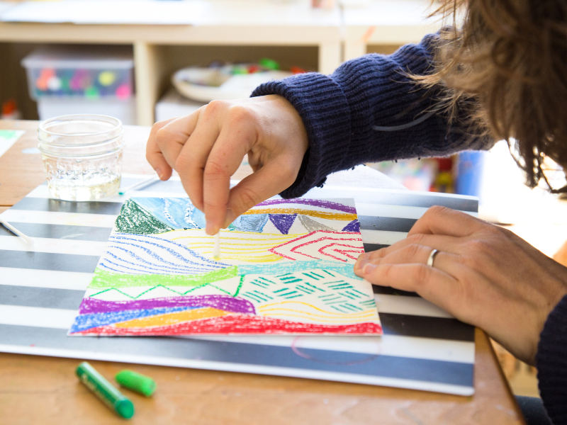 mom doing oil pastel painting