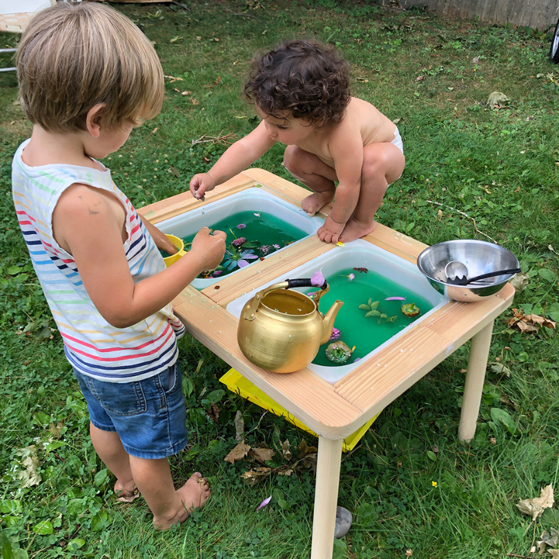 kids playing at sensory table
