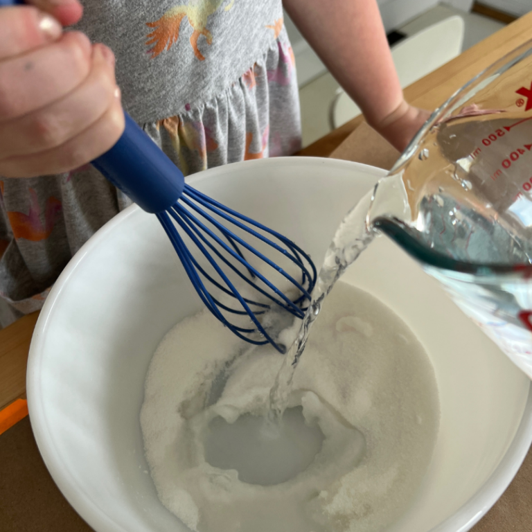 whisking water into sugar