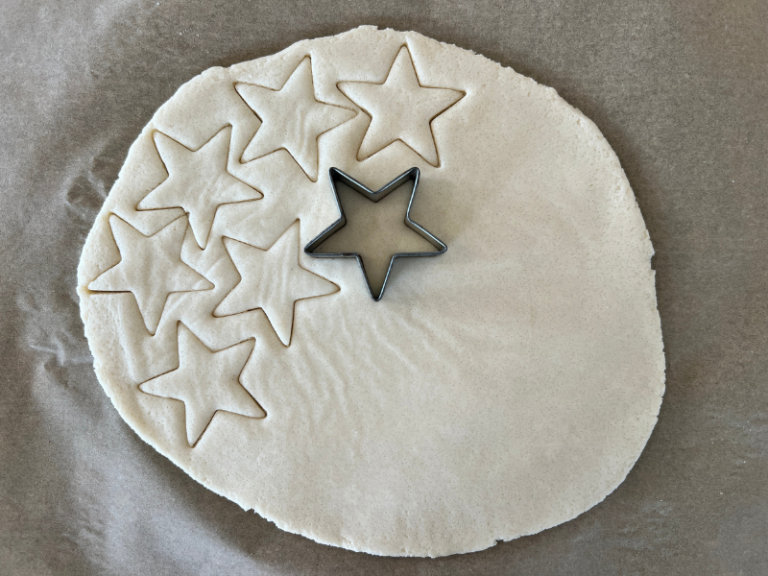 cutting out stars from dough