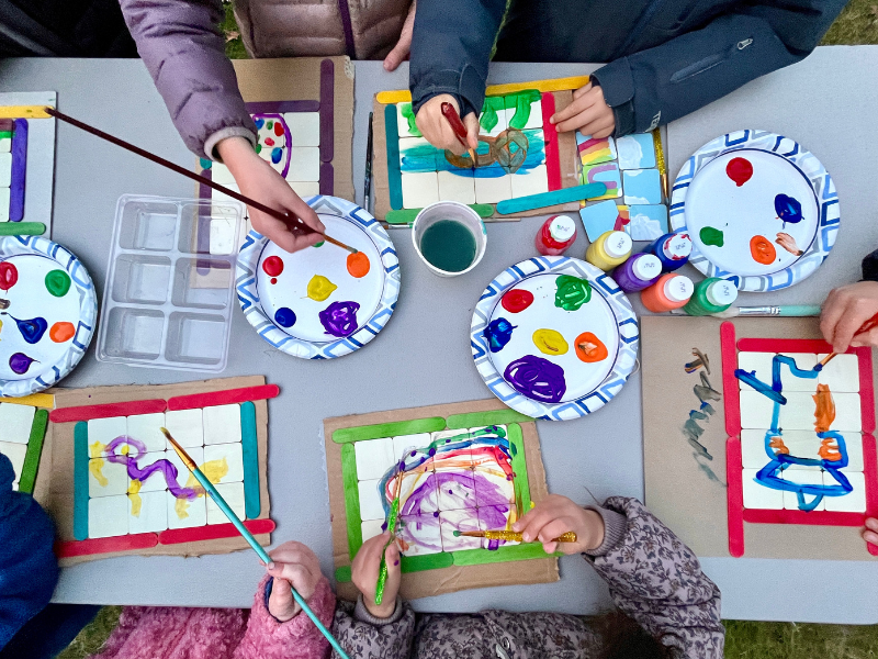 kids painting at table together