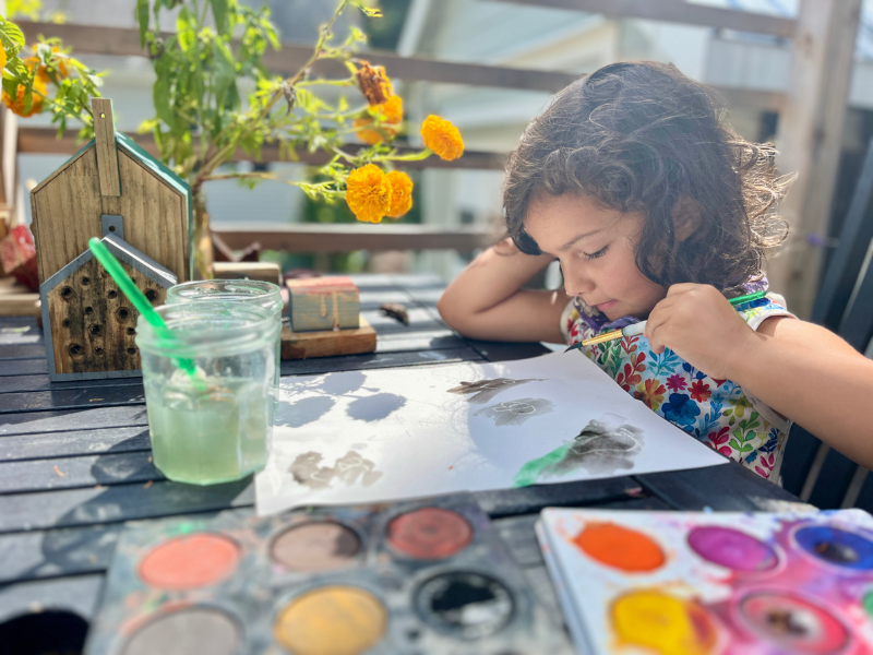 girl painting outside