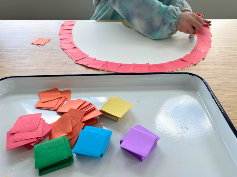 gluing tissue paper onto rainbow