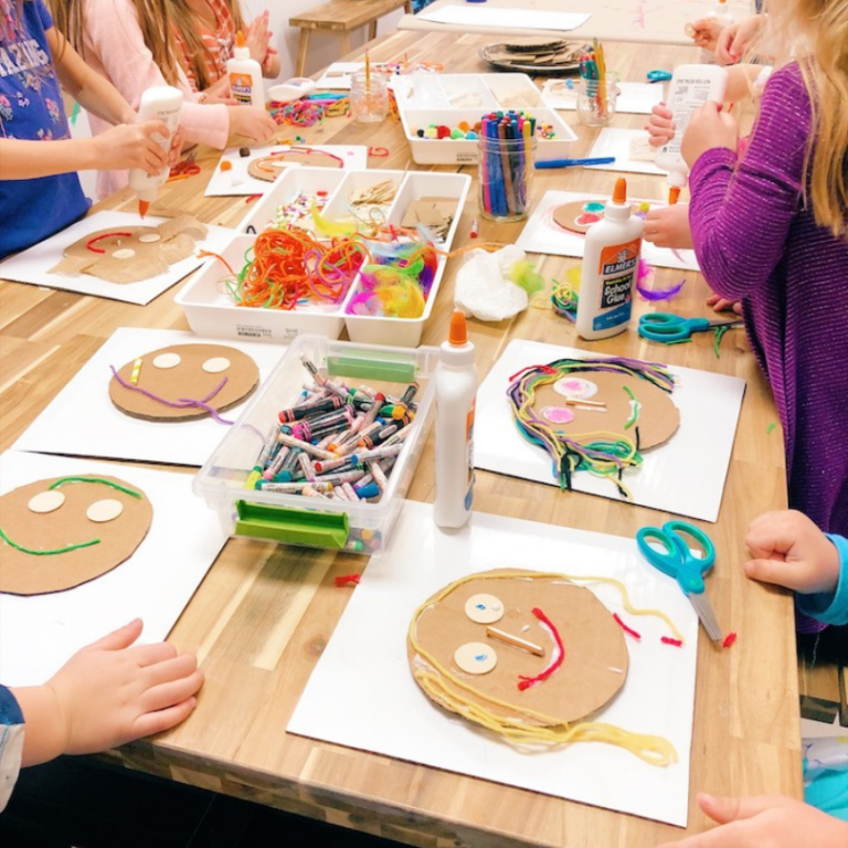 kids making collage portraits