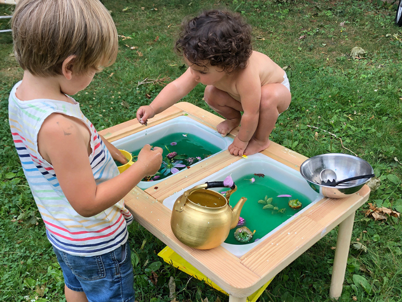 little kids at sensory table