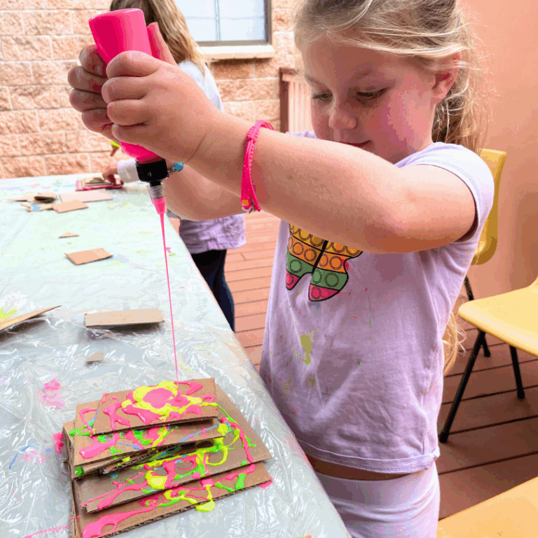adding pink glue to cardboard